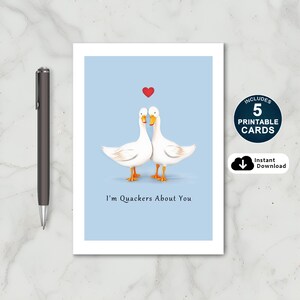 Celebrate love with our charming Ducks in Love Anniversary Card! Featuring two adorable ducks, a heart above, and the sweet message 'I'm Quackers About You.' Available in 5 popular sizes, it's a perfect way to make your loved one's day extra special.