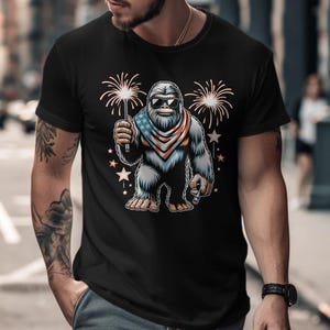 Bigfoot Patriotic T-Shirt, 4th of July Sasquatch Shirt, Independence Day Graphic Tee, USA Bigfoot Fireworks T-Shirt
