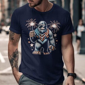 Patriotic Bigfoot Shirt, Fireworks Sasquatch Tee, 4th of July Graphic Shirt, Men’s Festival T-Shirt, Retro Style Bigfoot Apparel