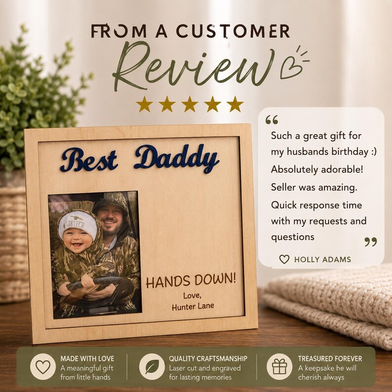 May include: A wooden picture frame with the words "Best Daddy" in navy blue script. The frame holds a photo of a man and child. The text "HANDS DOWN!" and "Love, Hunter Lane" are also visible. The frame is a keepsake.