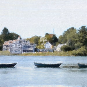 May include: A painting of a lake scene with three small boats in the water. The lake is in front of a row of houses and trees. The sky is a light blue color.