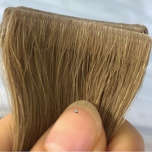 プレミアムヘアエクステンションの目に見えないテープ