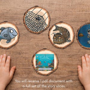 May include: A collection of illustrated wooden slices depicting scenes from a story, including fish and a diver. The central slice shows the book cover of "Tiddler". Text: "You will receive 1 pdf document with a full set of the story slices."