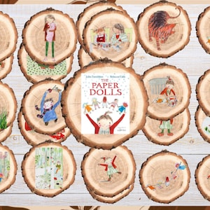 May include: A collection of circular wood slices featuring illustrations from the book The Paper Dolls by Julia Donaldson and Rebecca Cobb. Each slice displays a unique scene with characters, including a central slice showing the book cover.