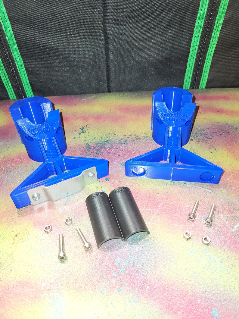 May include: Two blue 3D printed bike rack mounts with silver metal brackets, two black rubber bike rack sleeves, and silver screws and nuts.