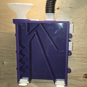 Support mural pour trieuse de graines