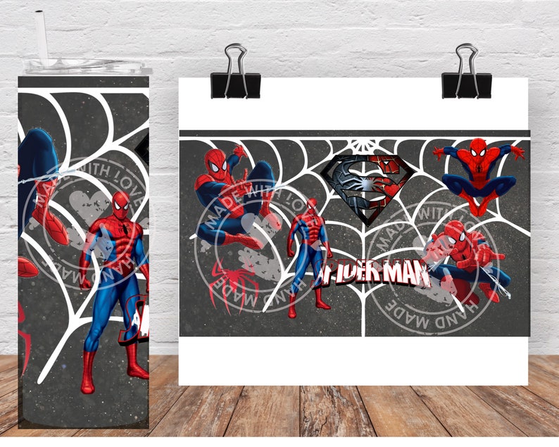 May include: A tumbler and a print featuring Spider-Man. The tumbler has a black and white web design with Spider-Man illustrations and the text "HAND MADE WITH LOVE". The print also features Spider-Man and the text "SPIDER MAN".