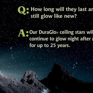 May include: A dark blue night sky with stars and two rocky mountains in the foreground. Text on the image reads: "Q: How long will they last and still glow like new? A: Our DuraGlo ceiling stars will continue to glow night after night for up to 25 years."
