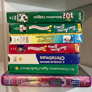 Vintage Christmas VHS Choose Your Own. Barney&#39;s, Charlie Brown, Disney Sing Alongs Songs