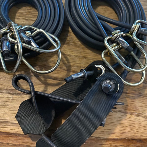 12 rubber tie cords that are 5 ft long with EZ reinforced hitches and heavy duty swivels