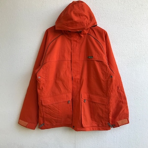 May include: Orange hooded jacket with a zipper closure, two front pockets, and a black trim. The jacket has a logo on the left chest.
