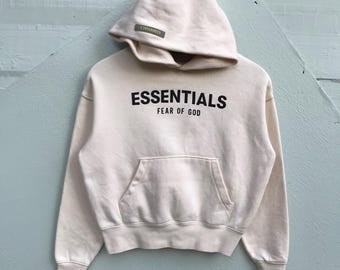 Sudadera pequeña con capucha Fear of God Essentials, jersey beige crema, sudadera pequeña de estilo urbano, sudadera minimalista de lujo.