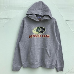 May include: Gray hooded sweatshirt with a Mossy Oak logo featuring a tree in a camouflage pattern. The logo is in red, green, and yellow.