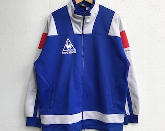 Vintage Le Coq Sportif chaqueta Vintage 90s Le Coq Sportif Track Top multicolor bordado logo suéter chaqueta hecha en Japón tamaño LL