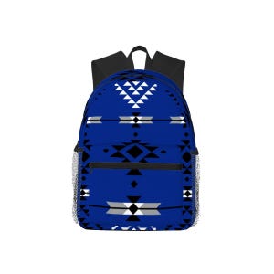 May include: A blue backpack with a geometric pattern in white, black, and gray. The backpack has a black top handle and shoulder straps, with mesh side pockets and a front zipper pocket.