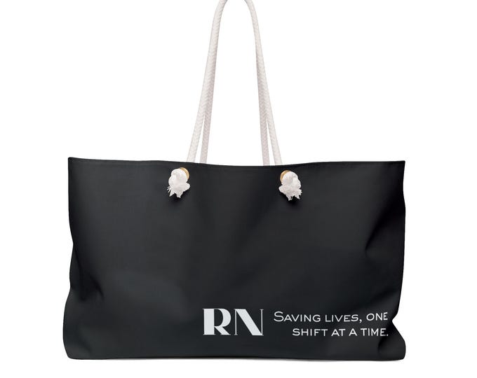 RN Saving Lives One Shift at a Time Black Weekender Bag | Nurse Tote