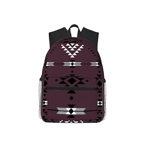 May include: A burgundy backpack with a geometric pattern in black, white, and gray. The backpack has black shoulder straps, a top handle, and mesh side pockets. The design features triangles and diamond shapes.