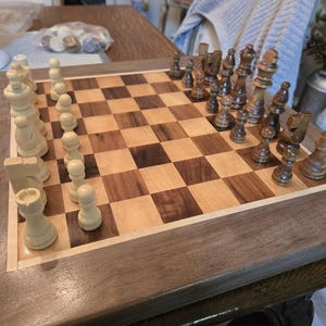 Custom walnut and maple chess board with chess and checker pieces