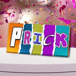 May include: A colorful chocolate bar with the name "PRICK" written in white, pink, blue, purple, and blue letters on a ripped background.