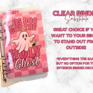 May include: A clear binder with a pink cover featuring a ghost illustration and the text "THIS BOO GOT THE HOLY Ghost". The binder has a silver metal ring mechanism and a snap closure.