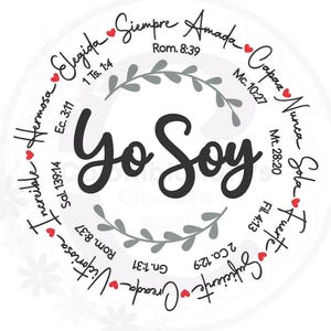 May include: A circular design with the words "Yo Soy" in the center, surrounded by inspirational words in Spanish, such as "Elegida" and "Amada." The design includes small red hearts and script lettering, with Bible verses.