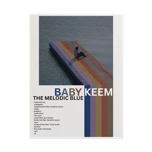 May include: A poster for "The Melodic Blue" by Baby Keem. The image features a person sitting on a rainbow-colored dock extending into a body of water. The artist's name and album title are in blue text. A list of song titles is also visible.