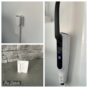 Könnte beinhalten: Ein weißer Elektroauto-Ladegerät mit einem schwarzen Griff und einem digitalen Display. Das Ladegerät ist an einer weißen Wand montiert. Das Ladegerät hat eine grüne Leuchte an der Seite.