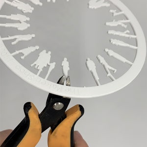 Miniature human figures laser cut 1:100