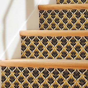 May include: A staircase featuring light-toned wooden treads and risers covered in a repeating pattern of black and white fan-shaped motifs set against a mustard yellow background. The design creates a consistent geometric look across the steps.