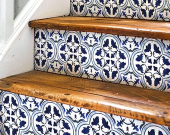 May include: Wooden stairs with blue and white patterned tile decals on the risers. The tile pattern features a repeating design of stylized flowers and leaves.