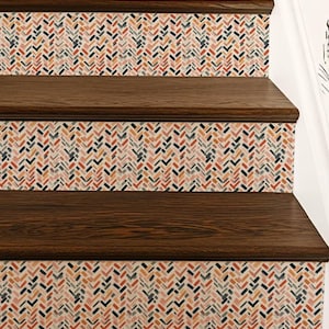 May include: A staircase featuring dark brown wooden treads and risers decorated with a repeating herringbone pattern. The pattern consists of small, multi-colored rectangular dashes in shades of coral, navy blue, and cream on a light background.