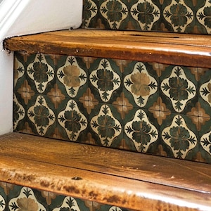 May include: A set of decorative stair treads featuring a green, brown and white floral pattern. The treads are made from a durable material and are easy to install.