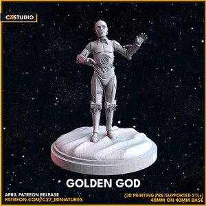 May include: A 3D printed model of a golden robot character standing on a white base. The model is 40mm tall and is pre-supported for 3D printing. The text "GOLDEN GOD" is printed below the base.