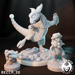 May include: Three white painted miniature figurines of fantastical creatures. The largest figurine is a dragon-like creature with a spiky crest and a long tail. The other two figurines are smaller and have a rounder, more amorphous shape. The figurines are set on circular bases.