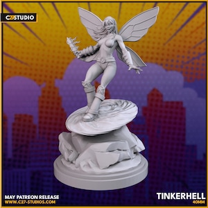 May include: A gray figurine of a fairy with large wings, wearing a bodysuit and boots, holding a glowing object. The figurine is standing on a rock formation base. The text "TINKERHELL 40MM" is visible.