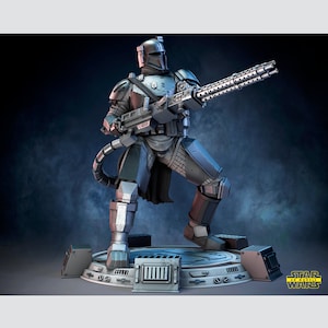 May include: A detailed, gray and blue action figure of a Star Wars Mandalorian with a large, multi-barreled weapon. The figure is standing on a circular base with a Star Wars logo.