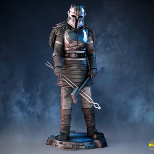May include: A silver and black action figure of a Star Wars character wearing a helmet and armor, holding a weapon. The figure is standing on a blue and gray base.