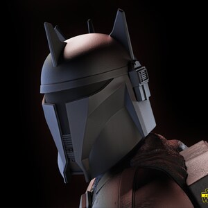 May include: A close-up of a black and gray Mandalorian helmet with a distinctive horned design. The helmet has a visor and a textured surface. The helmet is part of a Star Wars 3D model.