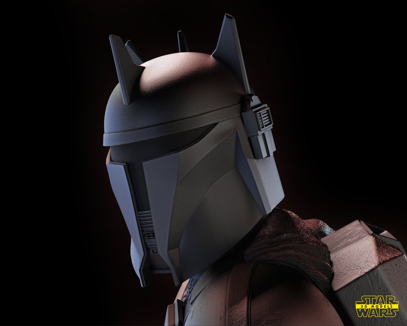 May include: A close-up of a black and gray Mandalorian helmet with a distinctive horned design. The helmet has a visor and a textured surface. The helmet is part of a Star Wars 3D model.