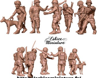May include: A collection of brown miniature US Marine figures from 1944, including soldiers with rifles, backpacks, and a dog. The text "Head Quarter US Marine 1944" and "28mm scale, other scale available" are visible.