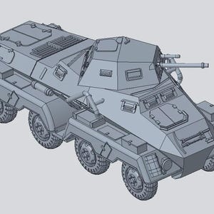 May include: A gray armored vehicle model with six wheels, a turret, and two gun barrels. The vehicle has a boxy design with multiple hatches and storage compartments. The model is rendered in a 3D style.