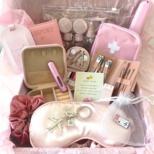 Travel essentials kit. pink holiday minis gift box. Travel hamper postal box. Pretty travel gift set for backpackers.