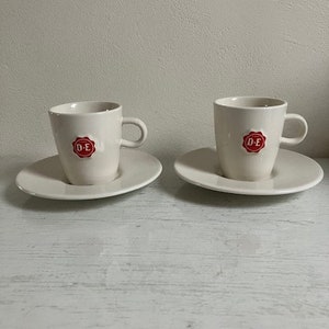 Set of two Douwe Egberts cups and saucers, design by Nikolai Carels