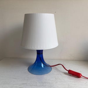 Ikea Lampan table lamp, blue base, white shade, red, cord, design Magnus Elebäck and Carl Öjerstam