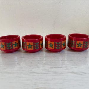 Set of four retro egg cups, plastic