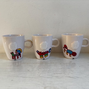 Set aus drei Douwe Egberts Tassen, Clemens Briels, Nicolai Carels, Mosa
