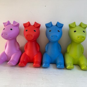 Ikea Gullgris piggy bank, green, blue, red and pink, design by Monika Mulder, piggy bank