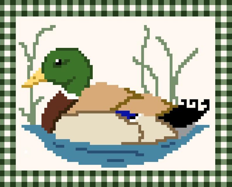 May include: A pixelated image of a duck in a pond, with a green head, brown body, and yellow beak. The duck is surrounded by blue water and green reeds, set against a cream background. The image is framed by a green and white checkered border.