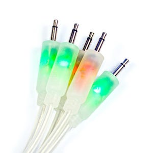 May include: Five clear audio cables with green and orange coloured tips. The cables are bundled together.