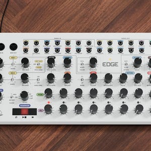 May include: A white and black Behringer Edge synthesizer with numerous knobs, buttons, and ports. The word "EDGE" is printed on the front. The synthesizer is on a wooden surface. The image also includes the text "HEINA KROON".